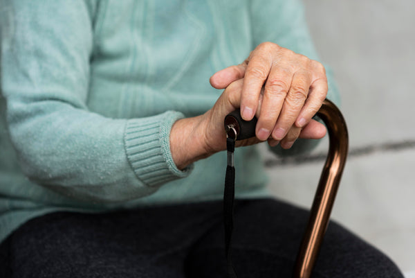 Senior woman with cane